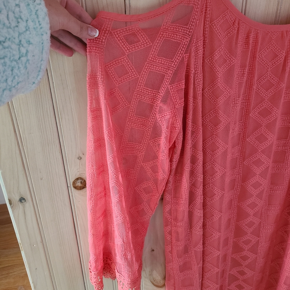 Coral scoop neck with sleeves.